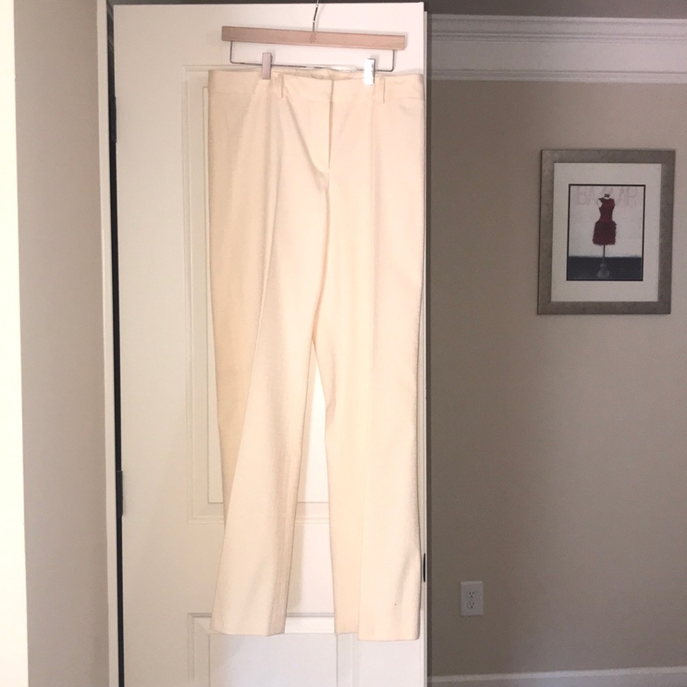 Beige embroidered pants.